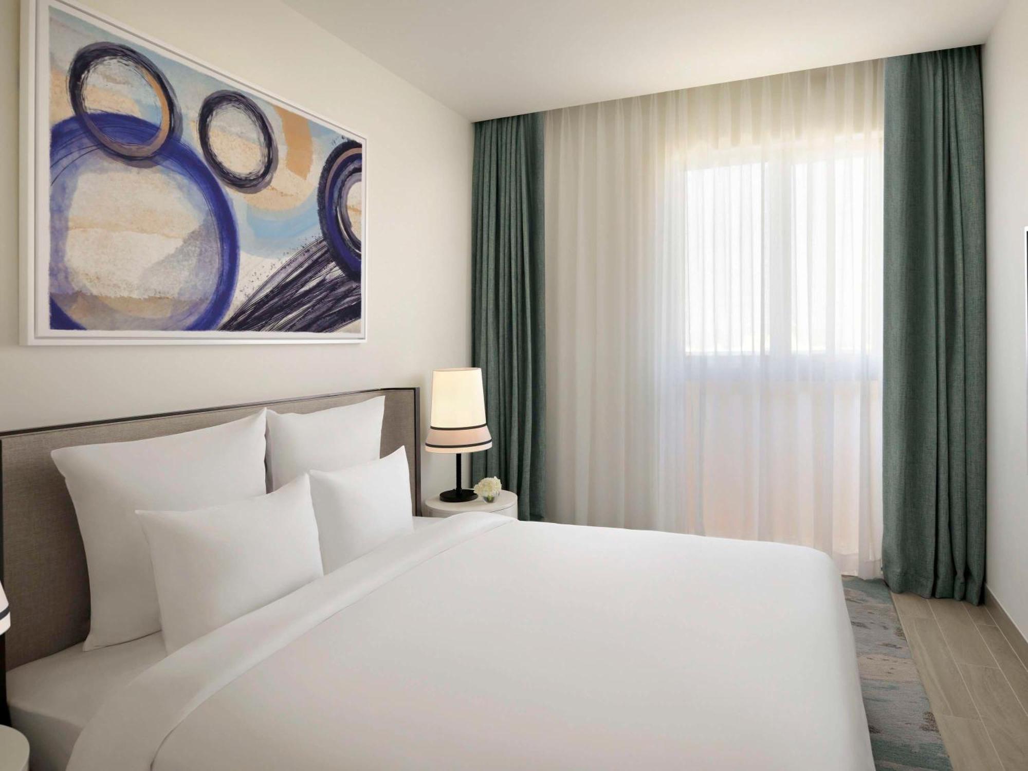 Moevenpick Hotel & Apartments Ghala Muscat Exterior photo A bedroom at the hotel